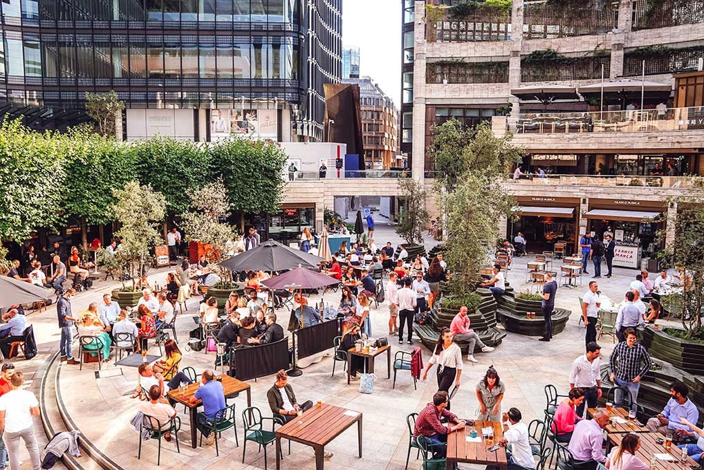 Outdoor pop-up bar crowd at Liverpool Street, London
